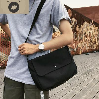 日系斜挎包潮牌复古邮差包男帆布包女文艺单肩包休闲简约大容量艾狄伊娃斜挎包男