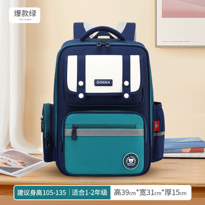 新款小学生英伦风儿童书包护脊护腰男女减负双肩包拼接防泼水_1